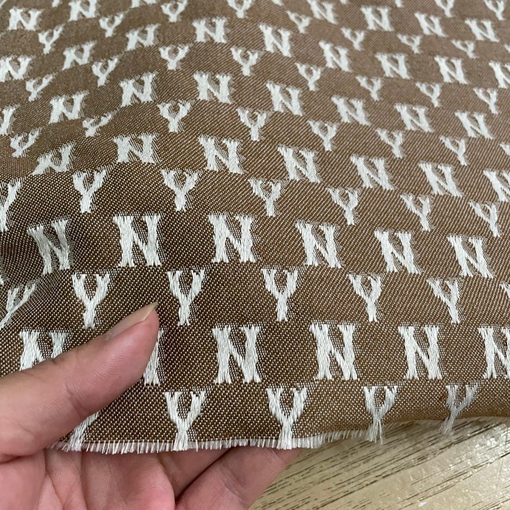 M02 NY Monogram Jacquard Fabric Blue and Khaki editorial product context 2