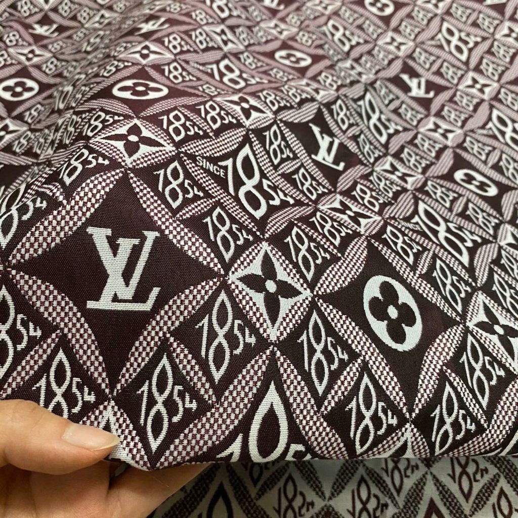 L15 Jacquard Fabric SINCE 1854 Reddish Brown editorial product context 1