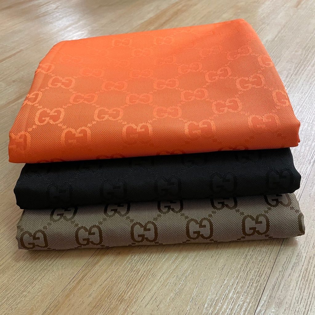 Jacquard Fabric Khaki Black Orange editorial product context 2