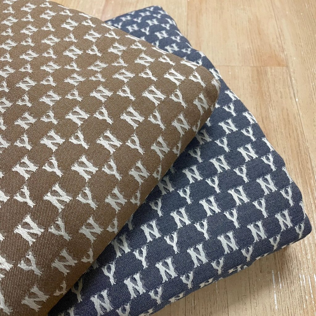 M02 NY Monogram Jacquard Fabric Blue and Khaki editorial product context 1